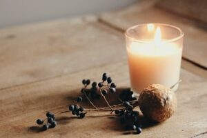 white candle on brown wooden table